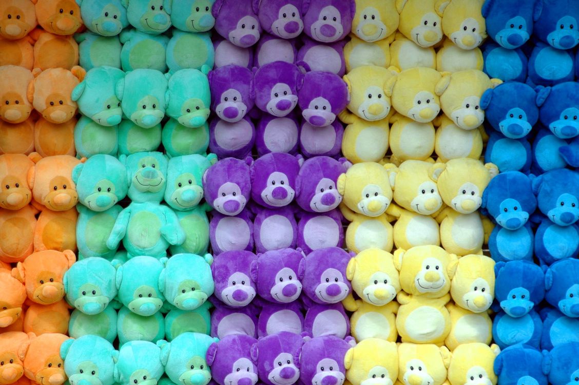 A colorful pile of soft plush toys