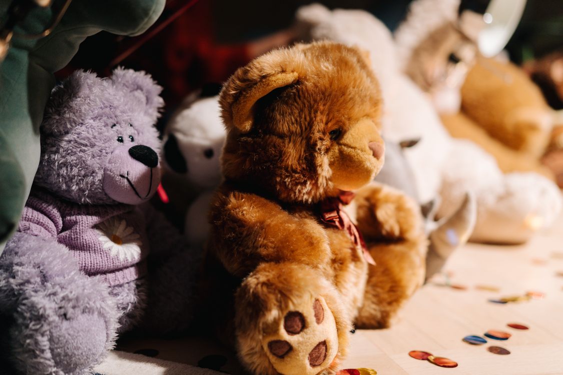 Assorted soft plush teddy bears close up
